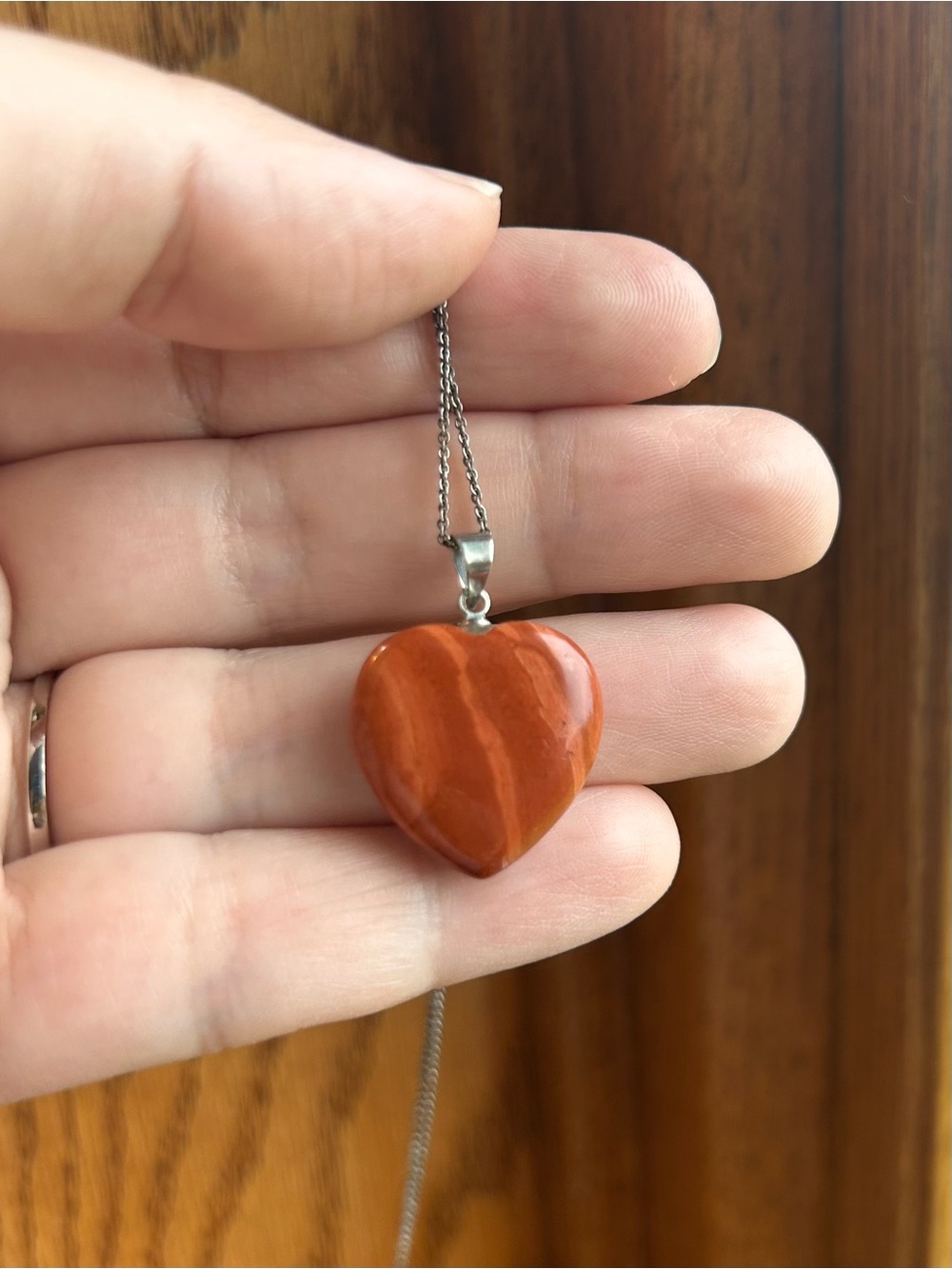 Sterling silver chain with orange stone heart pendant